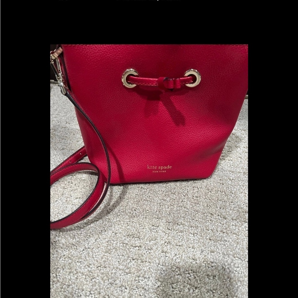 Beautiful red like new authentic Kate Spade mini Eva bag w/ matching wallet.